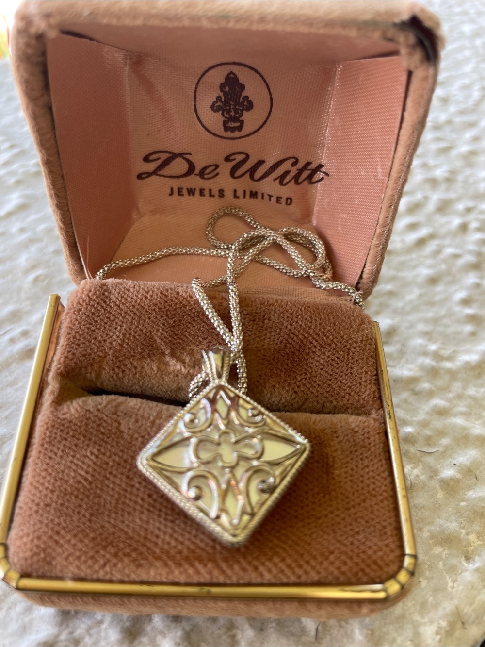 925 Sterling and Mother of Pearl. Reversable. Discoloration is a reflection.